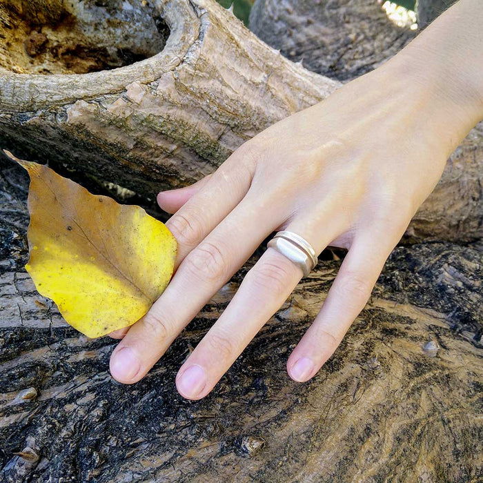 Delicate symmetrical silver ring