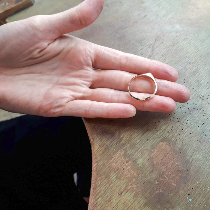 A thin pointed silver ring