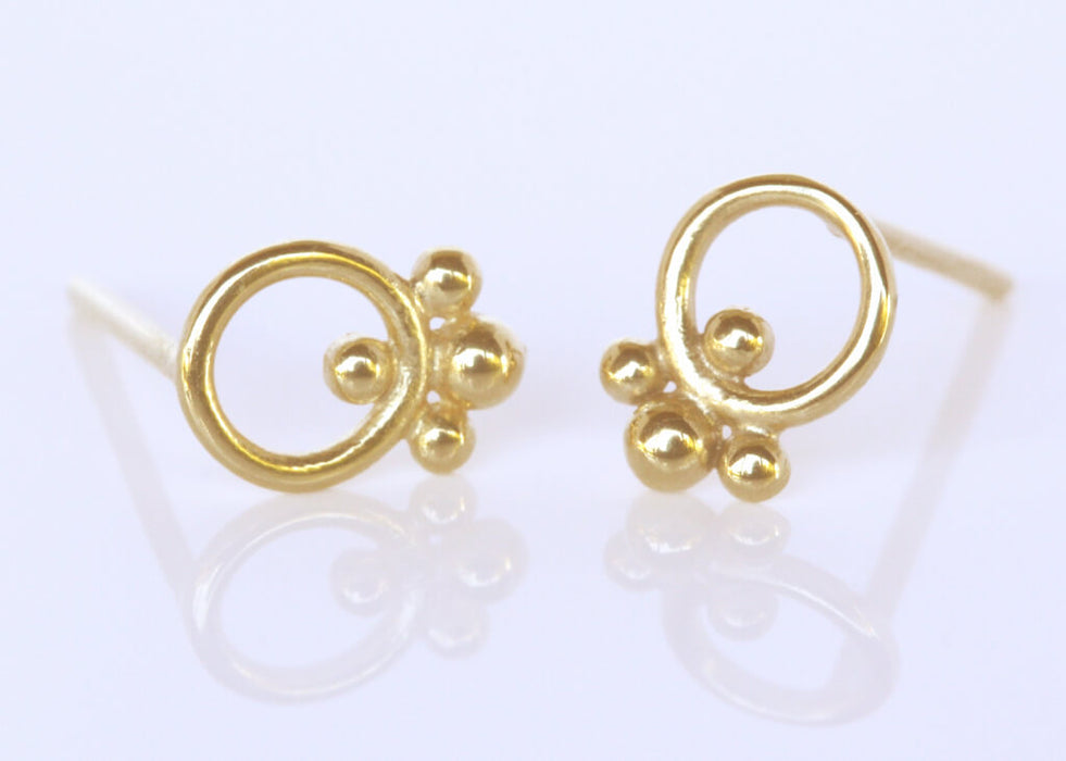 Gold circle earrings with ornaments