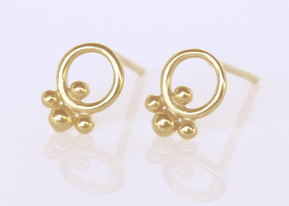 Gold circle earrings with ornaments