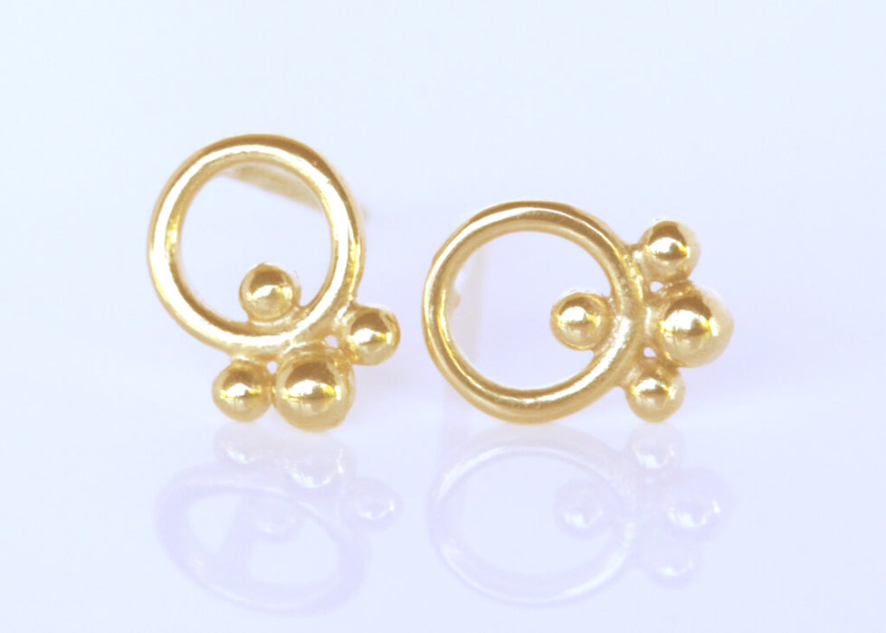 Gold circle earrings with ornaments