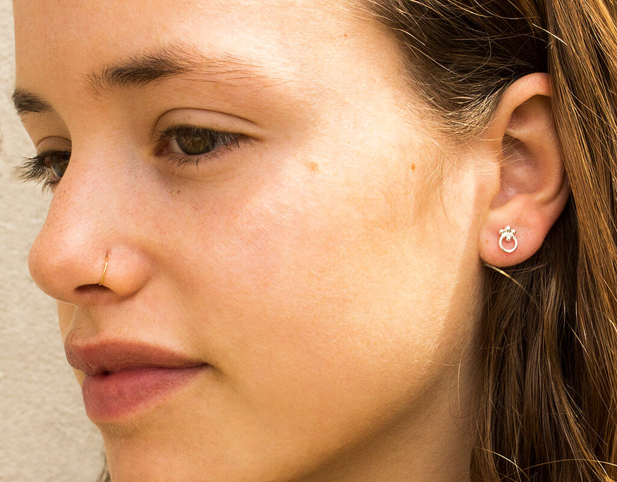 Gold circle earrings with ornaments