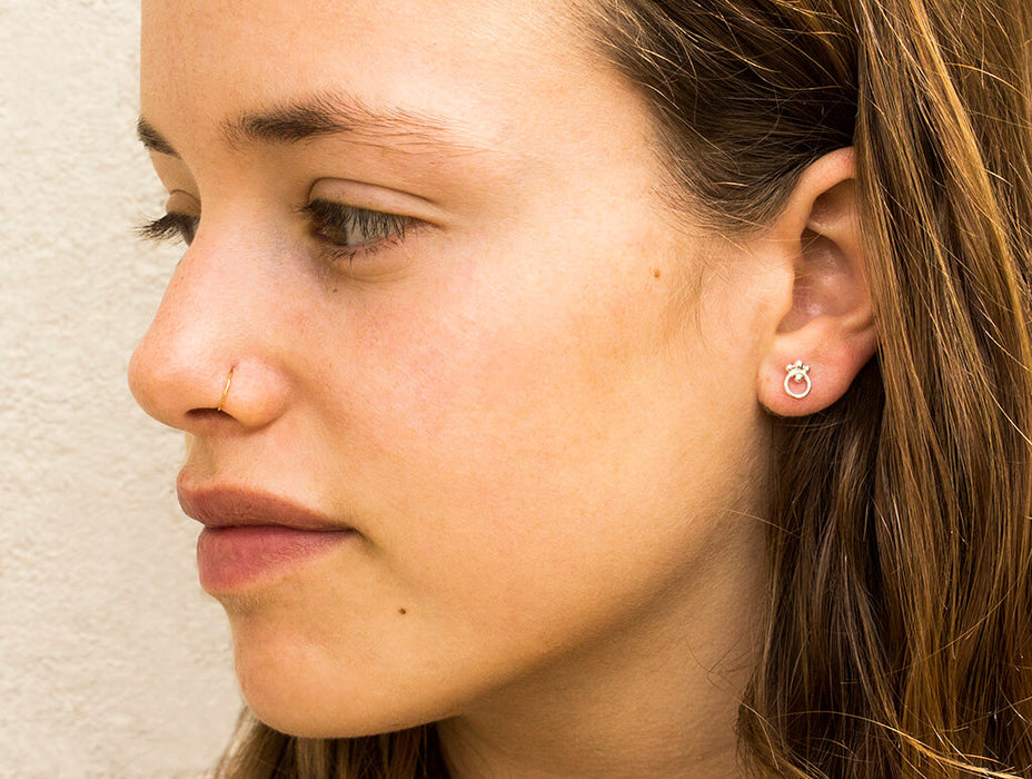 Gold circle earrings with ornaments